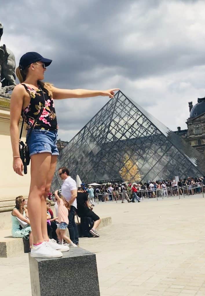 Standing out the front of the Louvre museum, a must see attraction to add to your itinerary