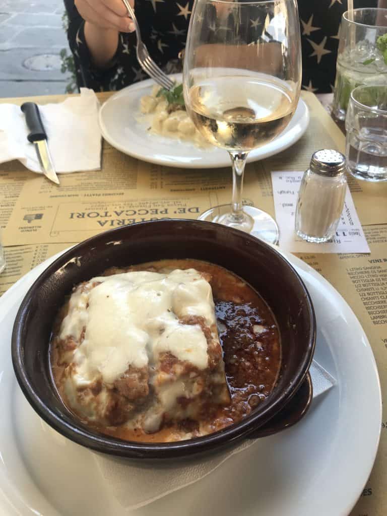 Lasagne and wine in a local trattoria after 1 day in Florence
