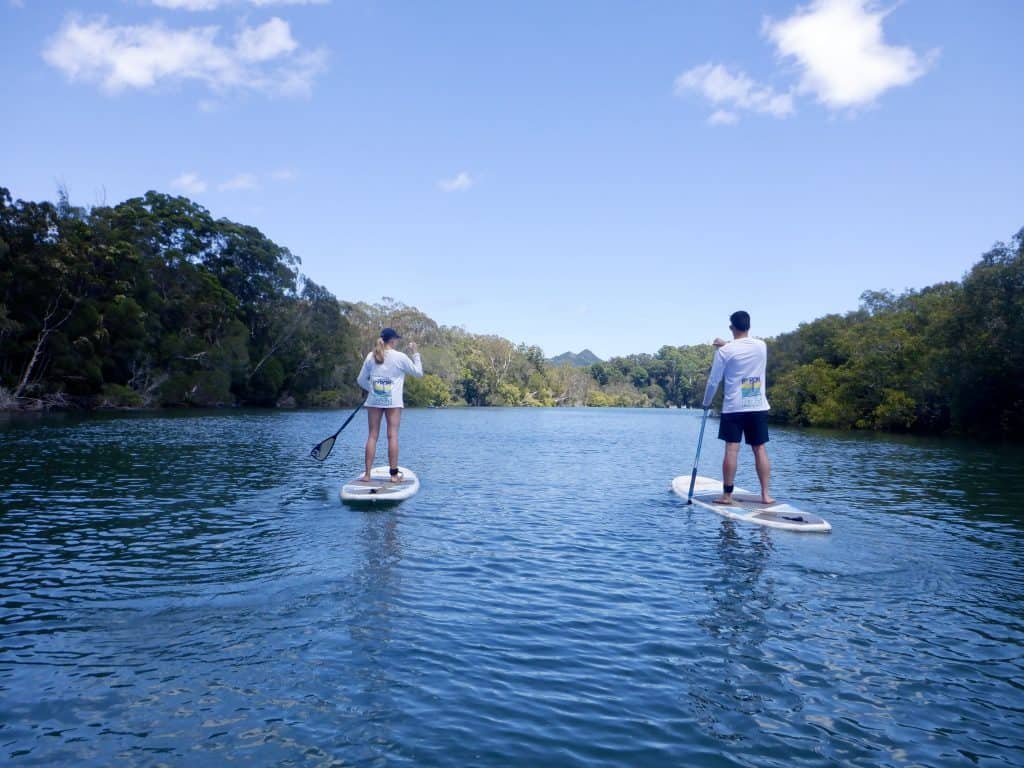 Taking a tour can be a more affordable way of travelling around Australia such as a stand up paddle boarding tour