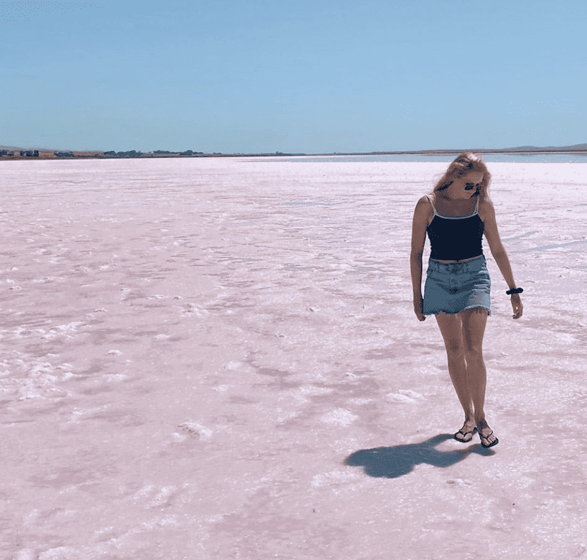 Visiting in a pink lake in Australia is a free activity. Making the most of the great outdoors is a great way to reduce costs